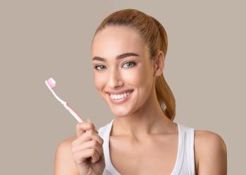 Woman holding a toothbrush